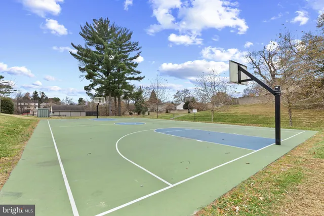 a view of an outdoor space and tennis court