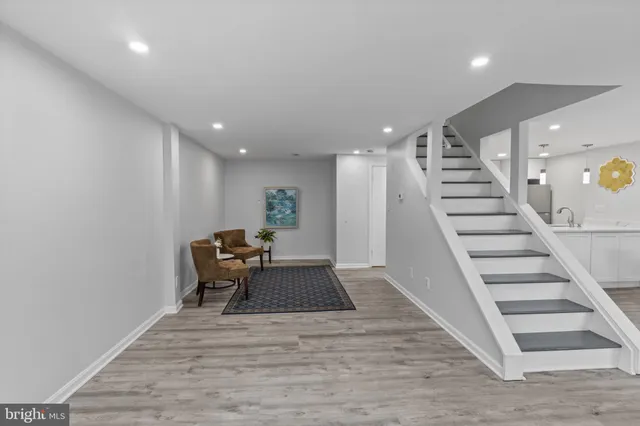 a view of entryway and hall with wooden floor