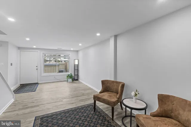 a living room with furniture and a rug