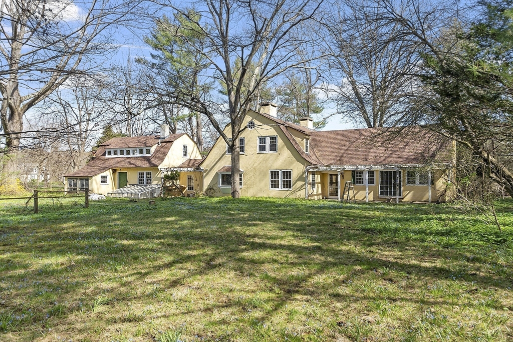 229 Musketaquid Road Concord, MA 01742 - Photo 1 of 21 a front view of a house with a garden