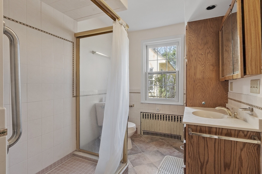 229 Musketaquid Road Concord, MA 01742 - Photo 16 of 21 a bathroom with a sink and a shower