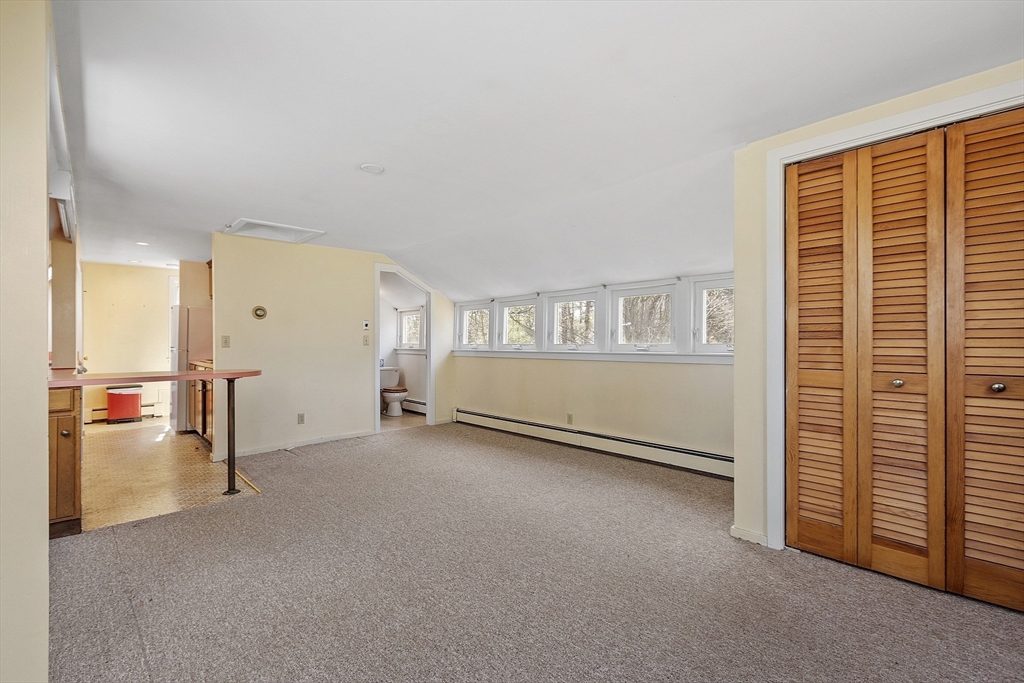 229 Musketaquid Road Concord, MA 01742 - Photo 17 of 21 an empty room with windows
