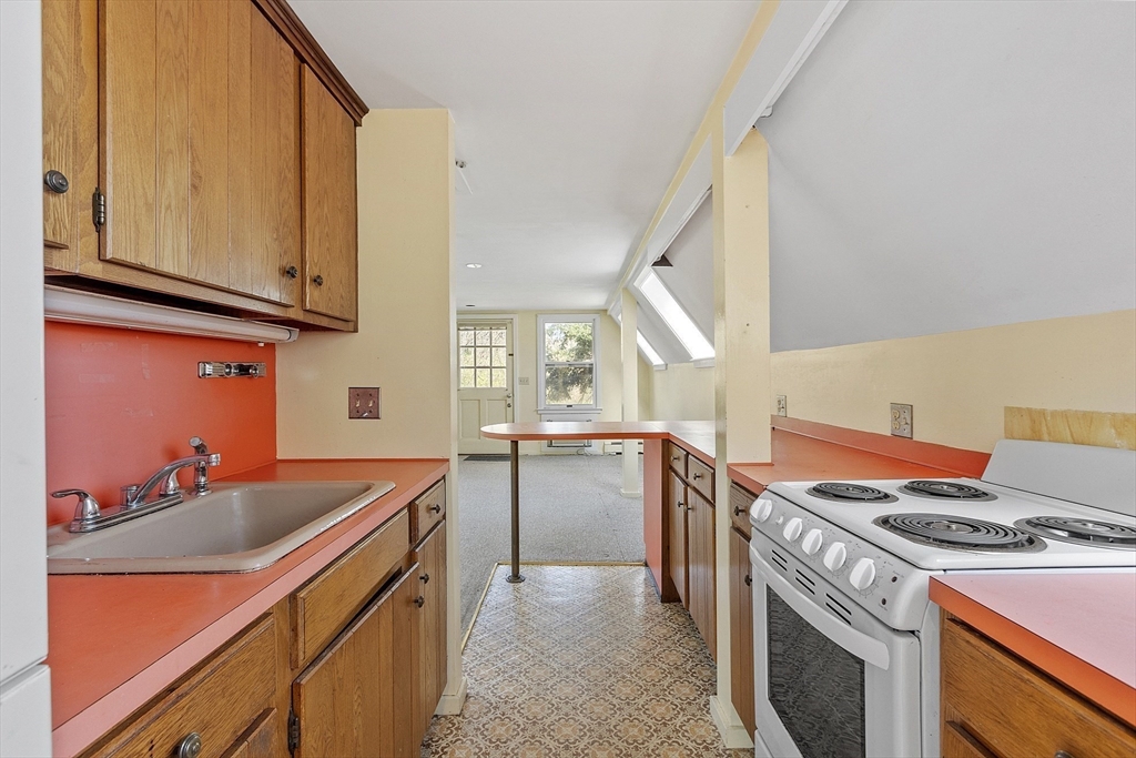 229 Musketaquid Road Concord, MA 01742 - Photo 18 of 21 a kitchen that has a sink and a stove