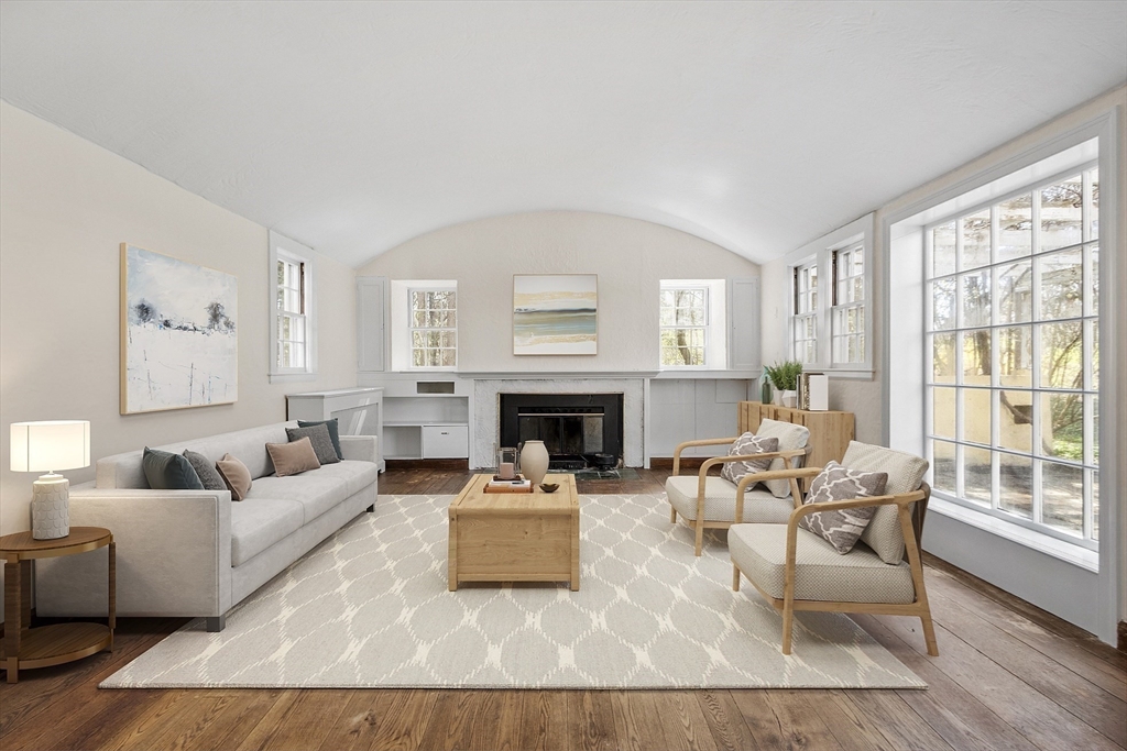 229 Musketaquid Road Concord, MA 01742 - Photo 4 of 21 a living room with furniture and a fireplace