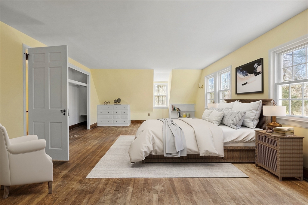 229 Musketaquid Road Concord, MA 01742 - Photo 10 of 21 a spacious bedroom with a bed and window
