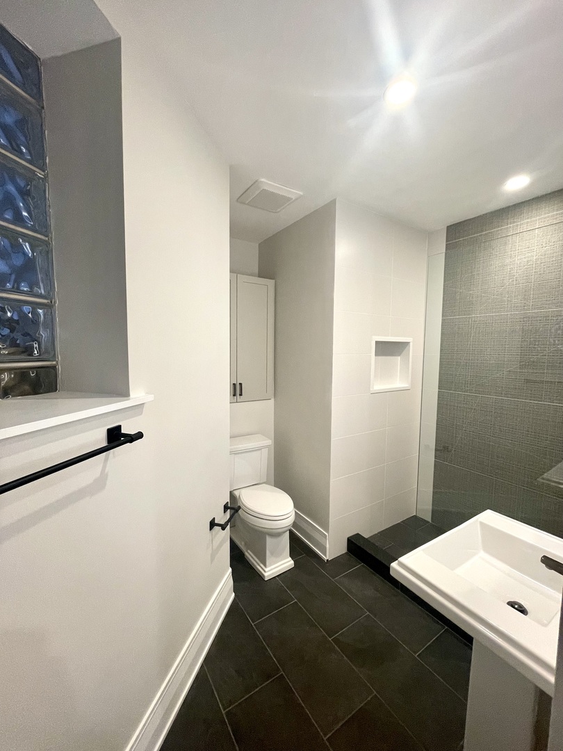 2539 West Iowa Street, Unit 1 Chicago, IL 60622 - Photo 12 of 19 a bathroom with a toilet and a shower