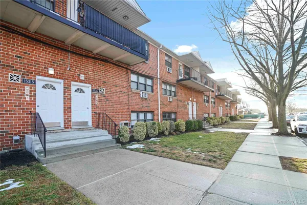 a view of a building with a yard