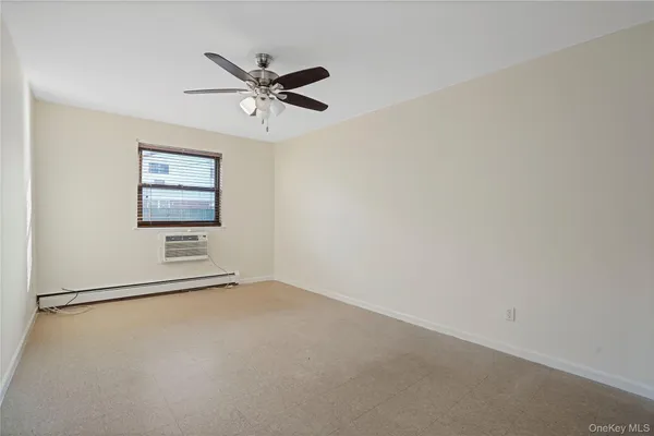 a view of a hallway with a window