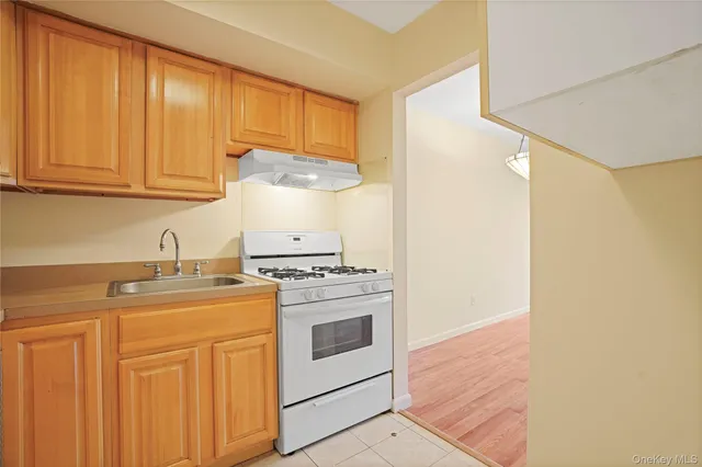 a kitchen with stainless steel appliances granite countertop a stove a sink and dishwasher