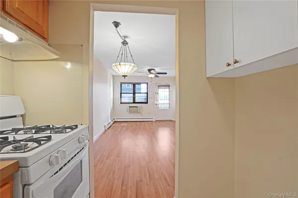 a kitchen with a wooden floor and a stove