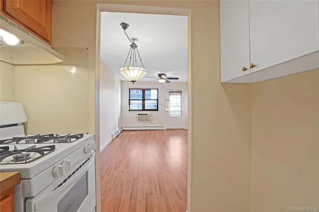 a kitchen with a wooden floor and a stove