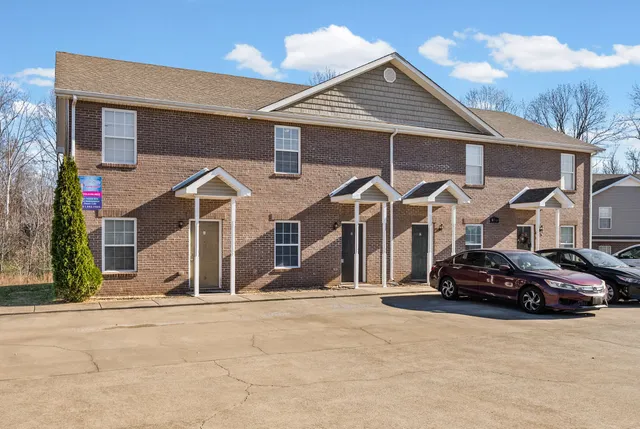 a view of a car park in front of house