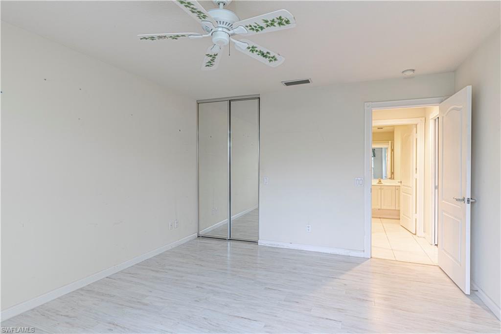 4187 St George Lane Naples, FL 34119 - Photo 15 of 33 wooden floor in an empty room