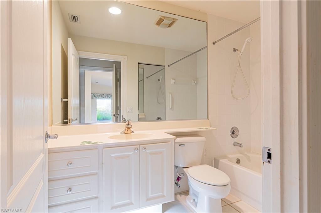 4187 St George Lane Naples, FL 34119 - Photo 19 of 33 a bathroom with a sink toilet and shower