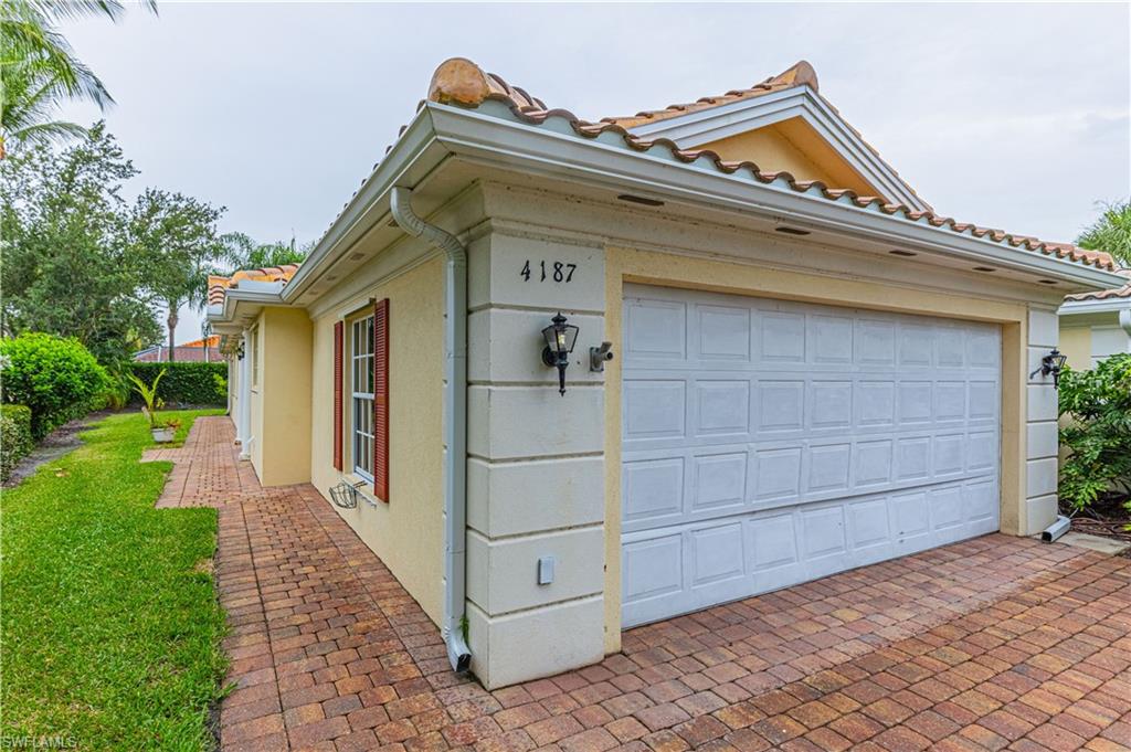 4187 St George Lane Naples, FL 34119 - Photo 23 of 33 a view of house and outdoor space