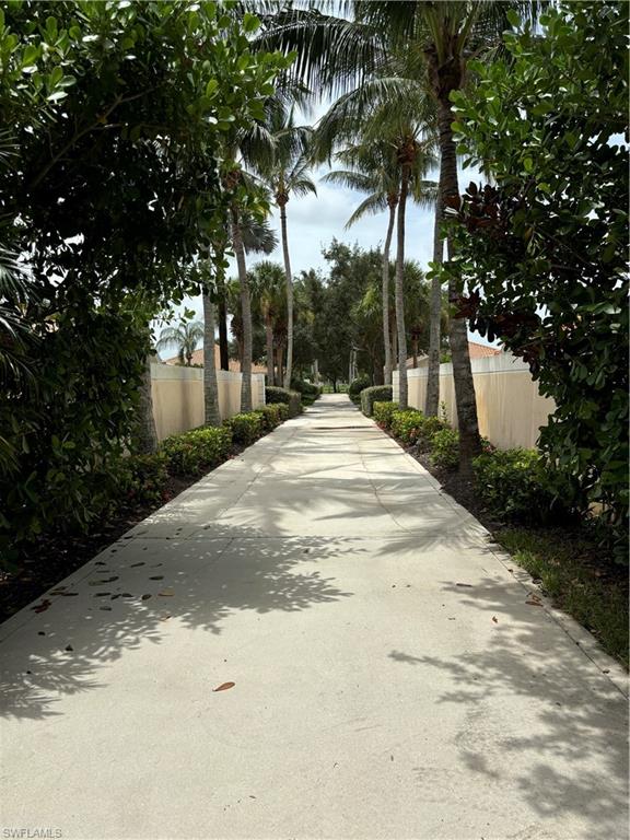 4187 St George Lane Naples, FL 34119 - Photo 28 of 33 a view of road and trees