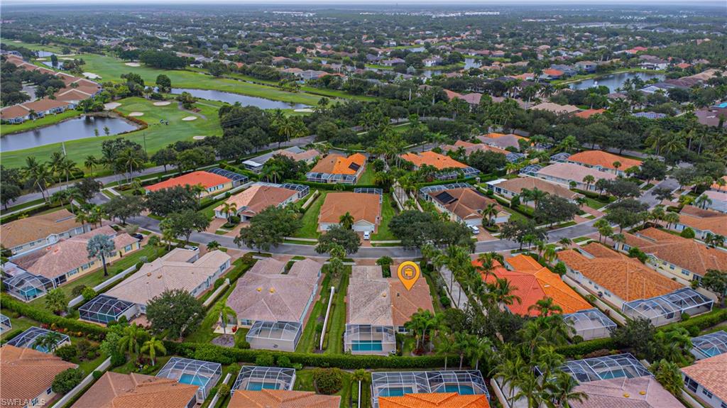 4187 St George Lane Naples, FL 34119 - Photo 5 of 33 an aerial view of residential houses with outdoor space
