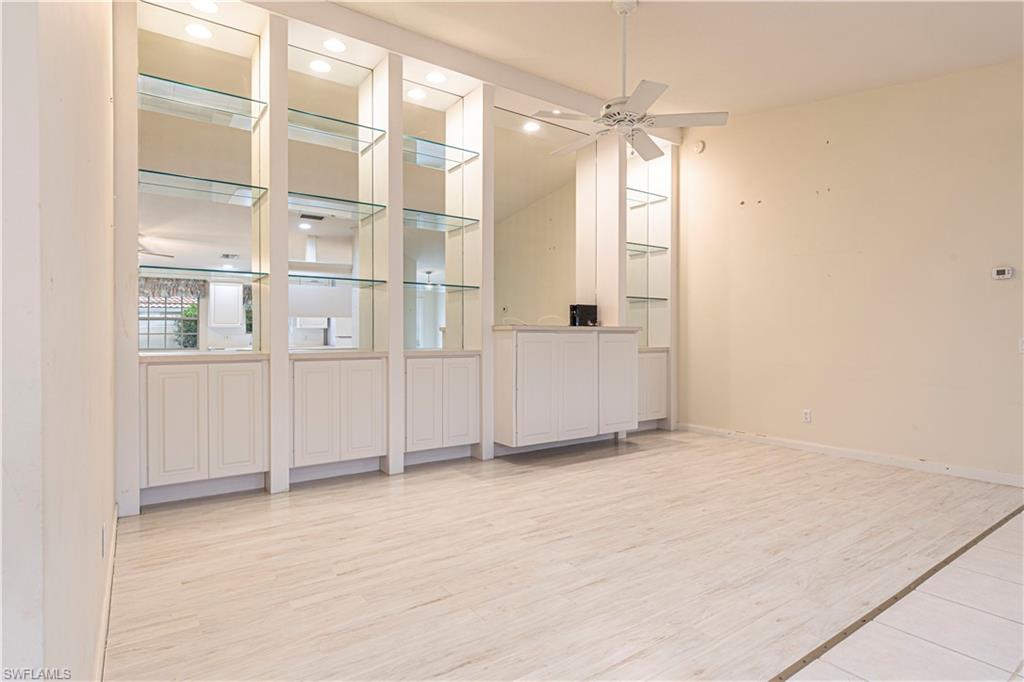 4187 St George Lane Naples, FL 34119 - Photo 6 of 33 an empty room with windows