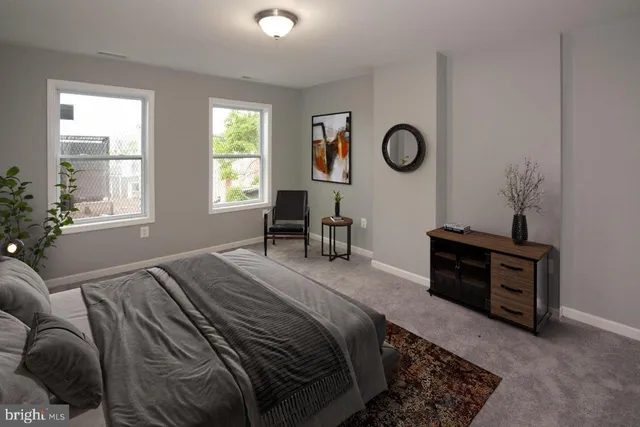 a bedroom with a bed and dresser with mirror