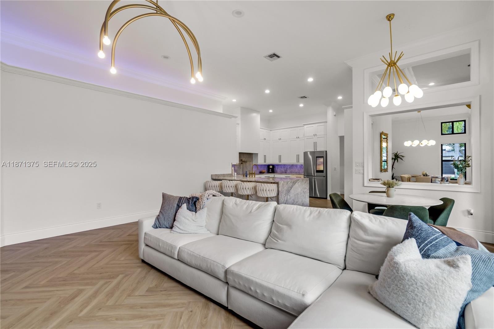 5478 Southwest 189th Avenue, Unit 5478 Miramar, FL 33029 - Photo 27 of 58 a living room with furniture and a chandelier