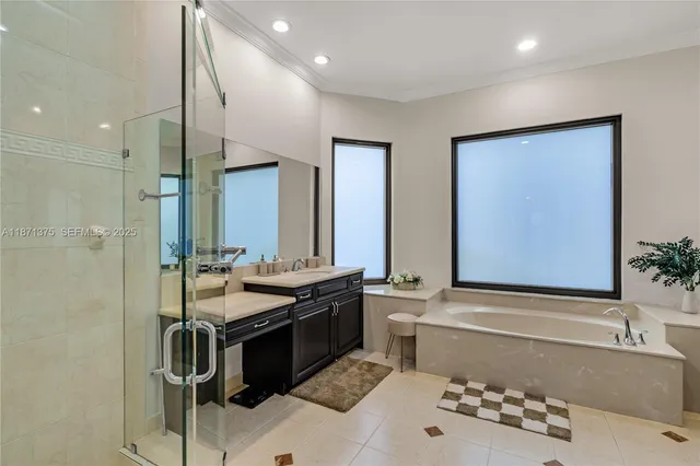 a bedroom with a bed window and a television