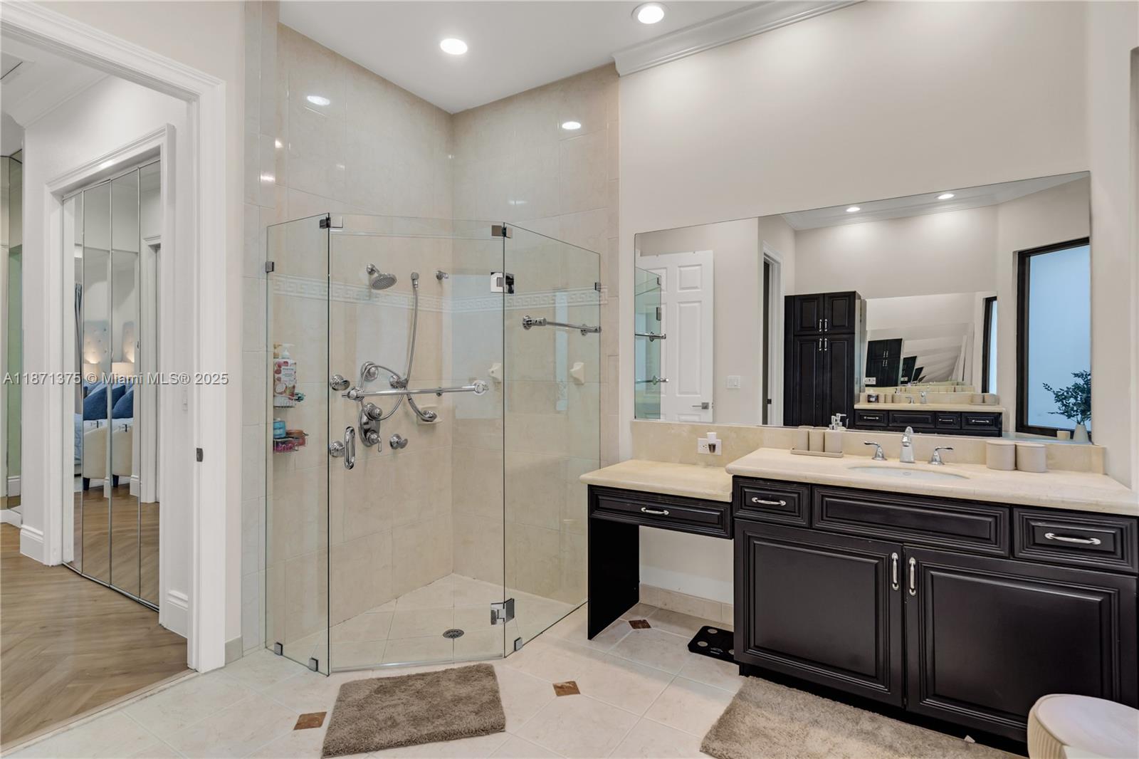 5478 Southwest 189th Avenue, Unit 5478 Miramar, FL 33029 - Photo 33 of 58 a bathroom with a double vanity sink mirror and shower