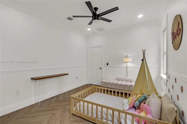 a bedroom with a bed and a dresser