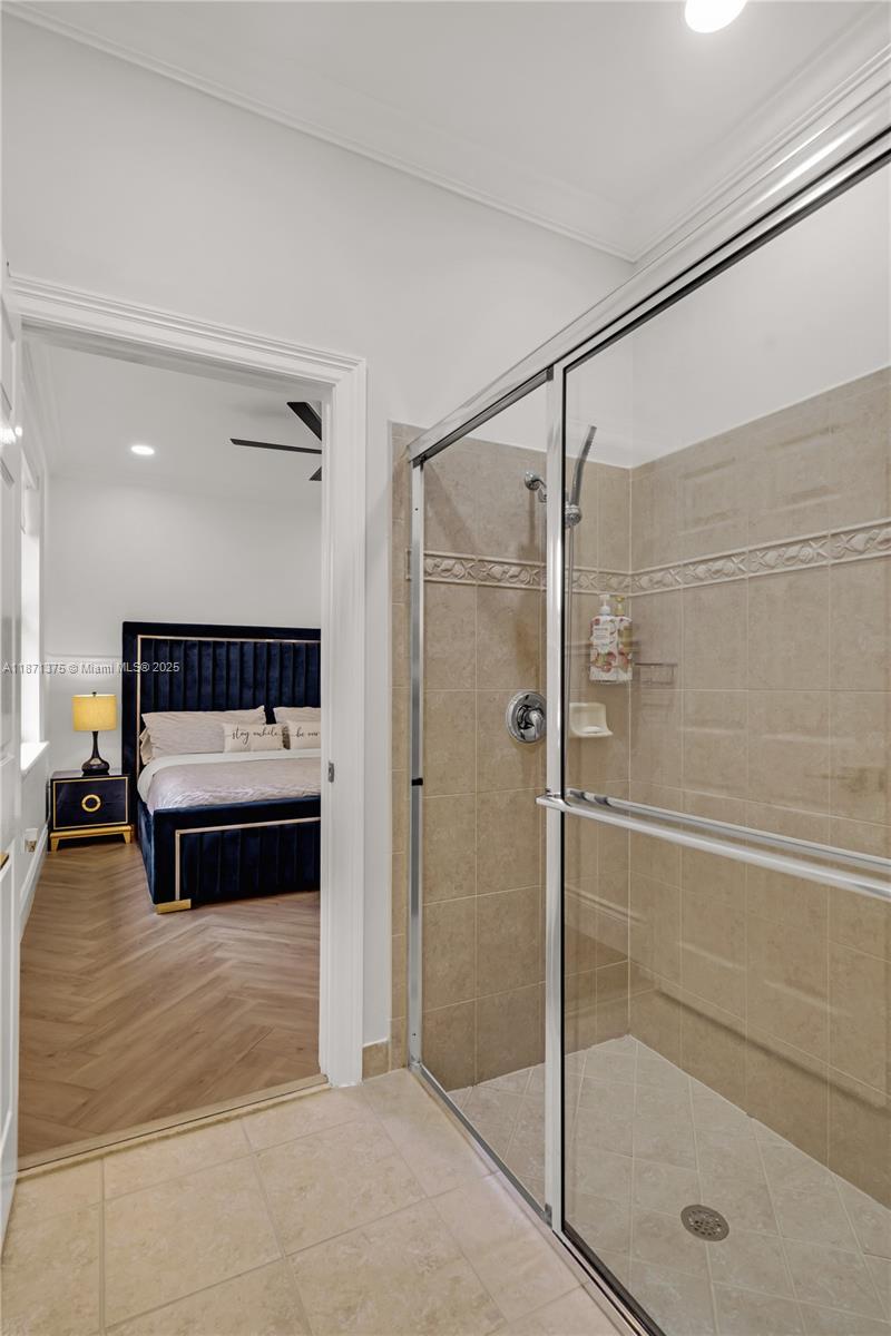 5478 Southwest 189th Avenue, Unit 5478 Miramar, FL 33029 - Photo 40 of 58 a bathroom with a glass shower door