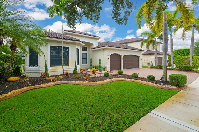 a front view of house with yard and outdoor seating