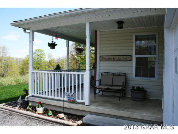 134 Overlook Road Monterey, VA 24465 - Photo 13 of 36 a view of a porch with a chair