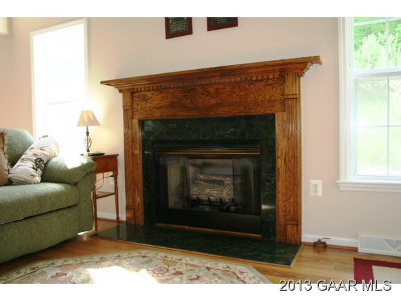 134 Overlook Road Monterey, VA 24465 - Photo 25 of 36 a living room with furniture a window and a fireplace