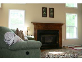 134 Overlook Road Monterey, VA 24465 - Photo 26 of 36 a living room with furniture and a fireplace