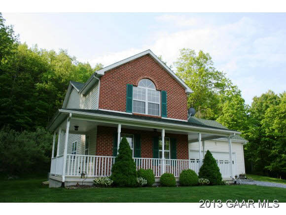 134 Overlook Road Monterey, VA 24465 - Photo 5 of 36 a front view of a house with a garden