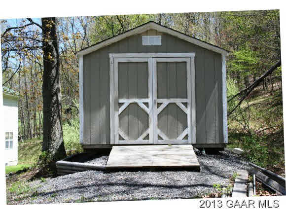 134 Overlook Road Monterey, VA 24465 - Photo 10 of 36 a front view of a house with garden
