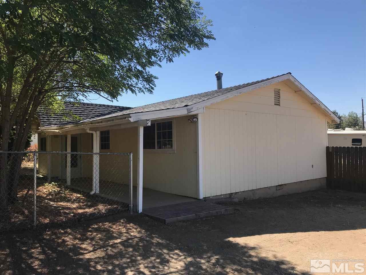 8579 Aquifer Way Reno, NV 89506 - Photo 2 of 17 a front view of a house with a yard