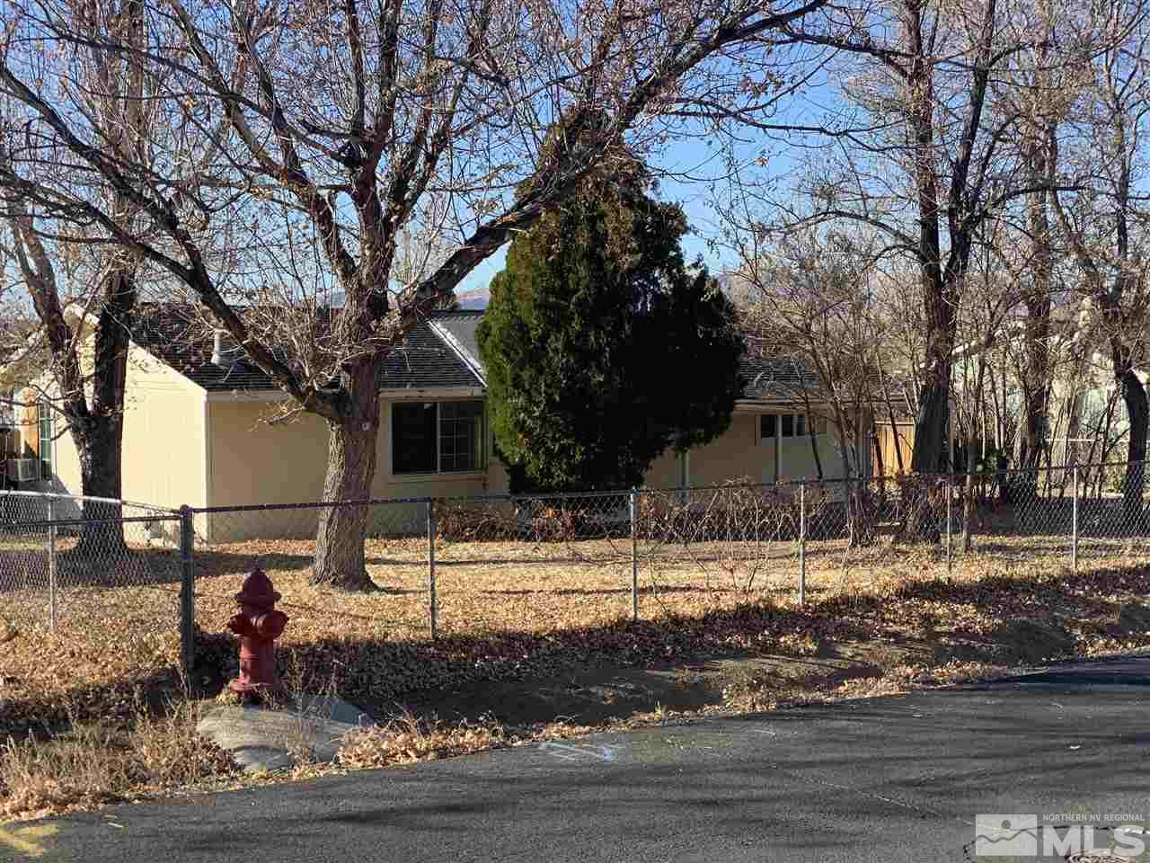 8579 Aquifer Way Reno, NV 89506 - Photo 3 of 17 a view of a house with a yard