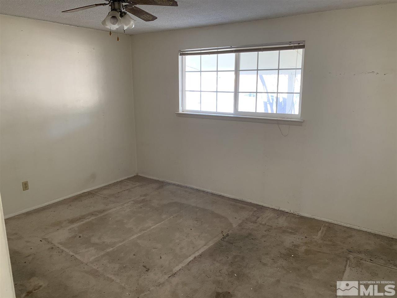 8579 Aquifer Way Reno, NV 89506 - Photo 9 of 17 an empty room with a window