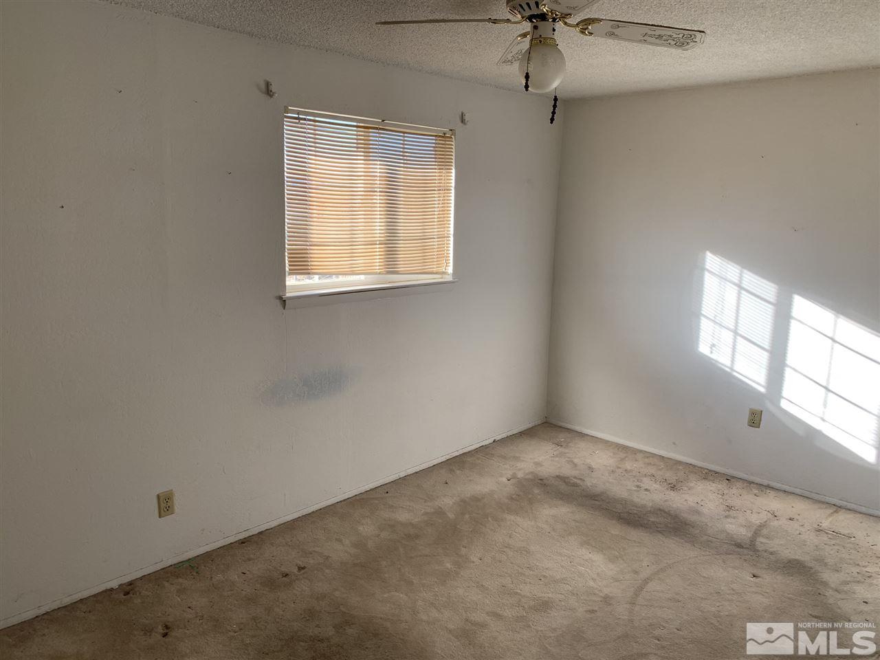 8579 Aquifer Way Reno, NV 89506 - Photo 10 of 17 an empty room with a window