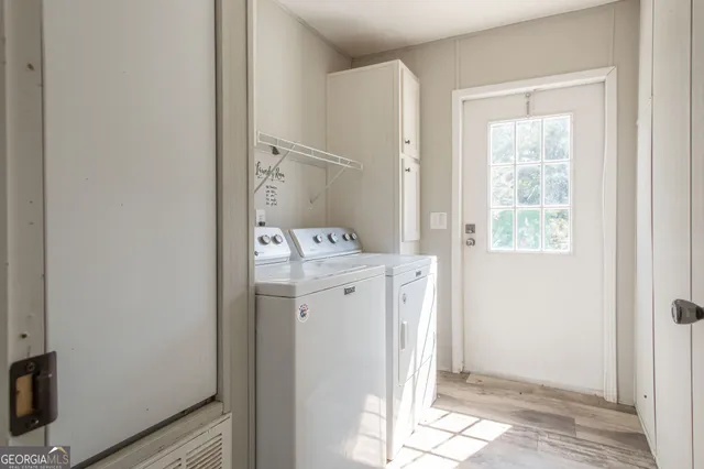 a utility room with a window dryer and washer