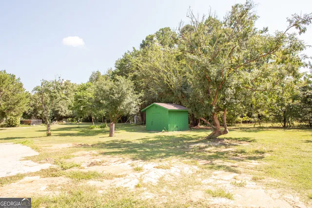 a view of a swimming pool with an outdoor space and seating area
