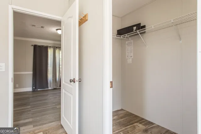 a view of a bathroom from a hallway