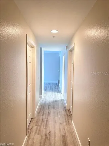 a spacious bathroom with a double vanity sink a mirror and a bathtub