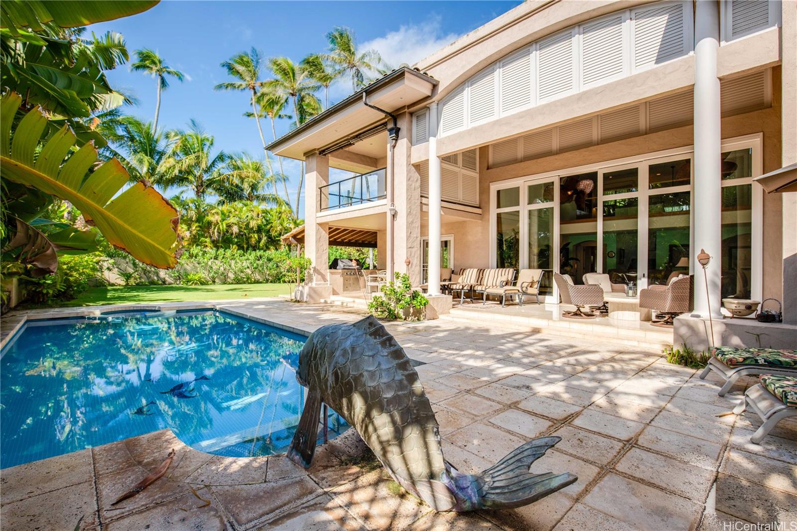 233 Portlock Road Honolulu, HI 96825 - Photo 1 of 1 a swimming pool with patio outdoor seating and yard