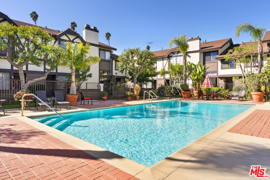 19355 Sherman Way, Unit 33 Reseda, CA 91335 - Photo 18 of 22 a view of a building with a yard