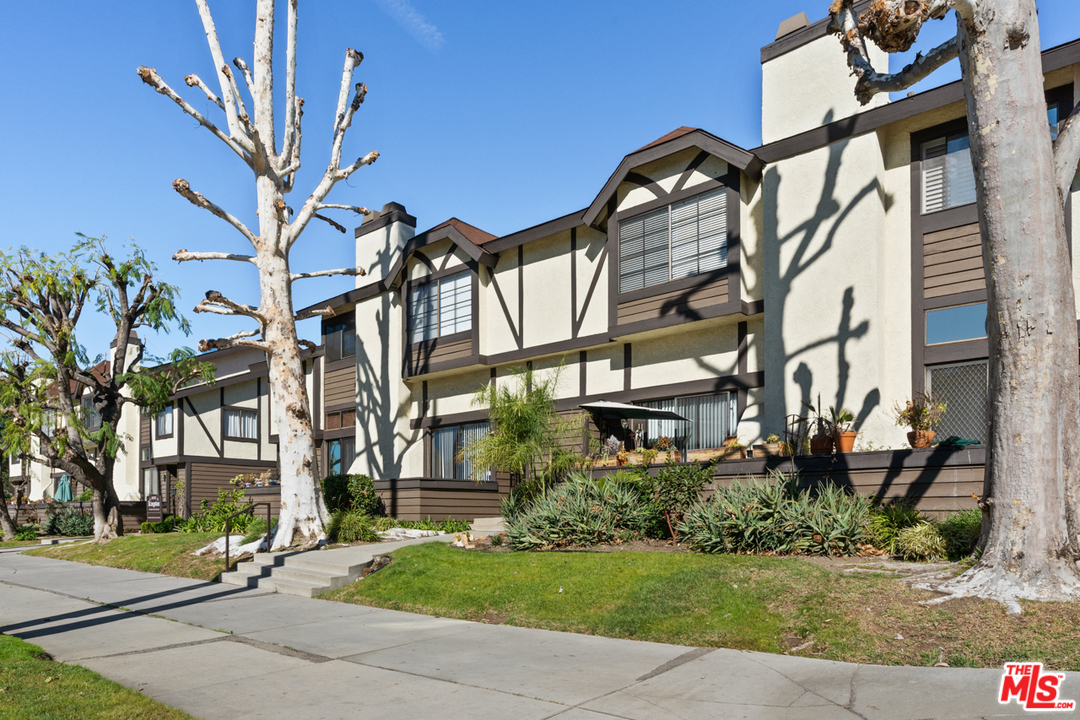 19355 Sherman Way, Unit 33 Reseda, CA 91335 - Photo 22 of 22 a view of a house with a yard