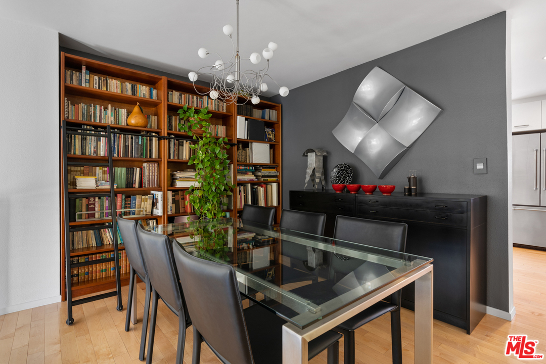 19355 Sherman Way, Unit 33 Reseda, CA 91335 - Photo 6 of 22 a dining room with furniture and a chandelier