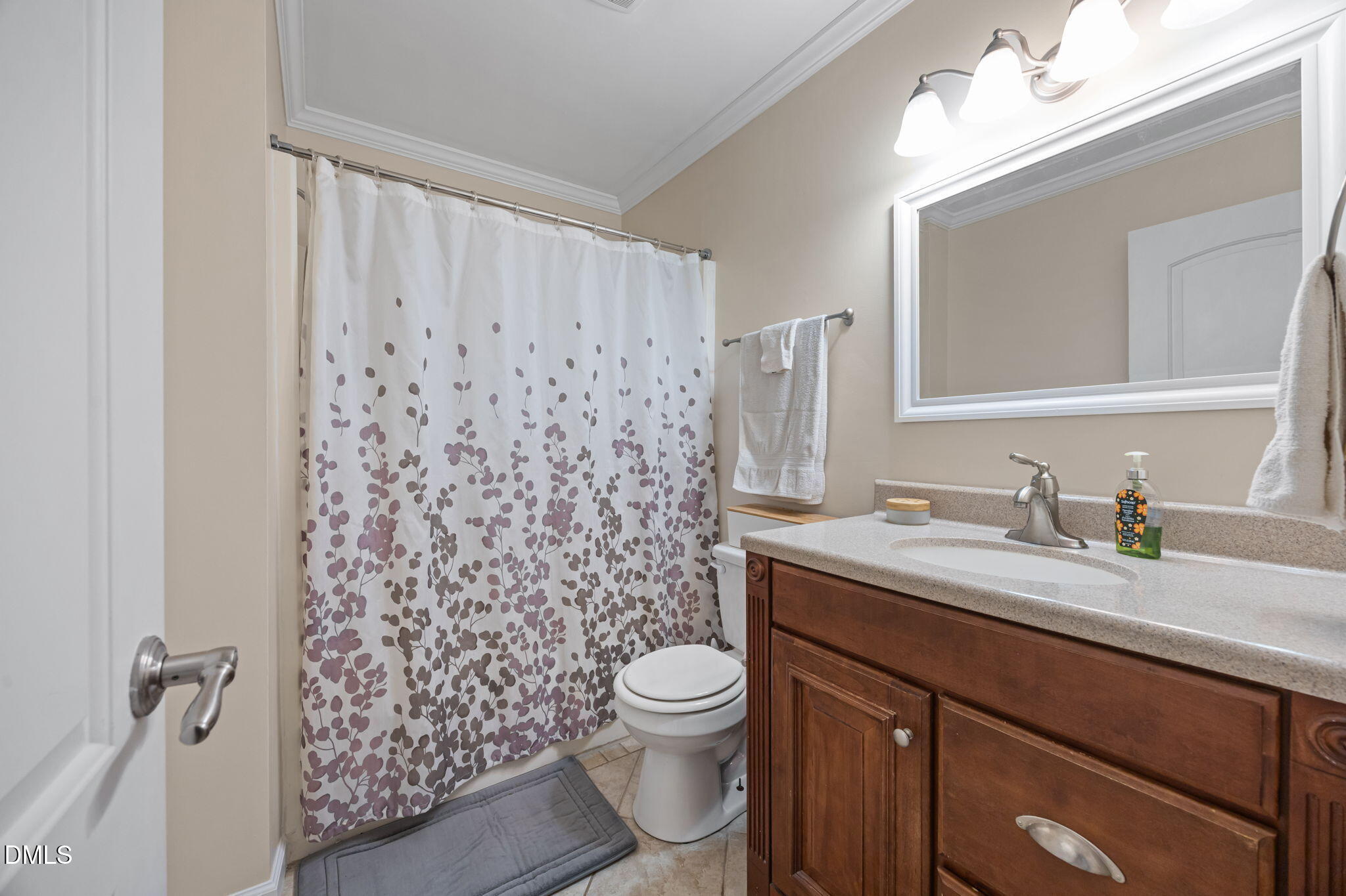 212 Esquire Lane Cary, NC 27513 - Photo 16 of 31 a bathroom with a granite countertop sink toilet and mirror
