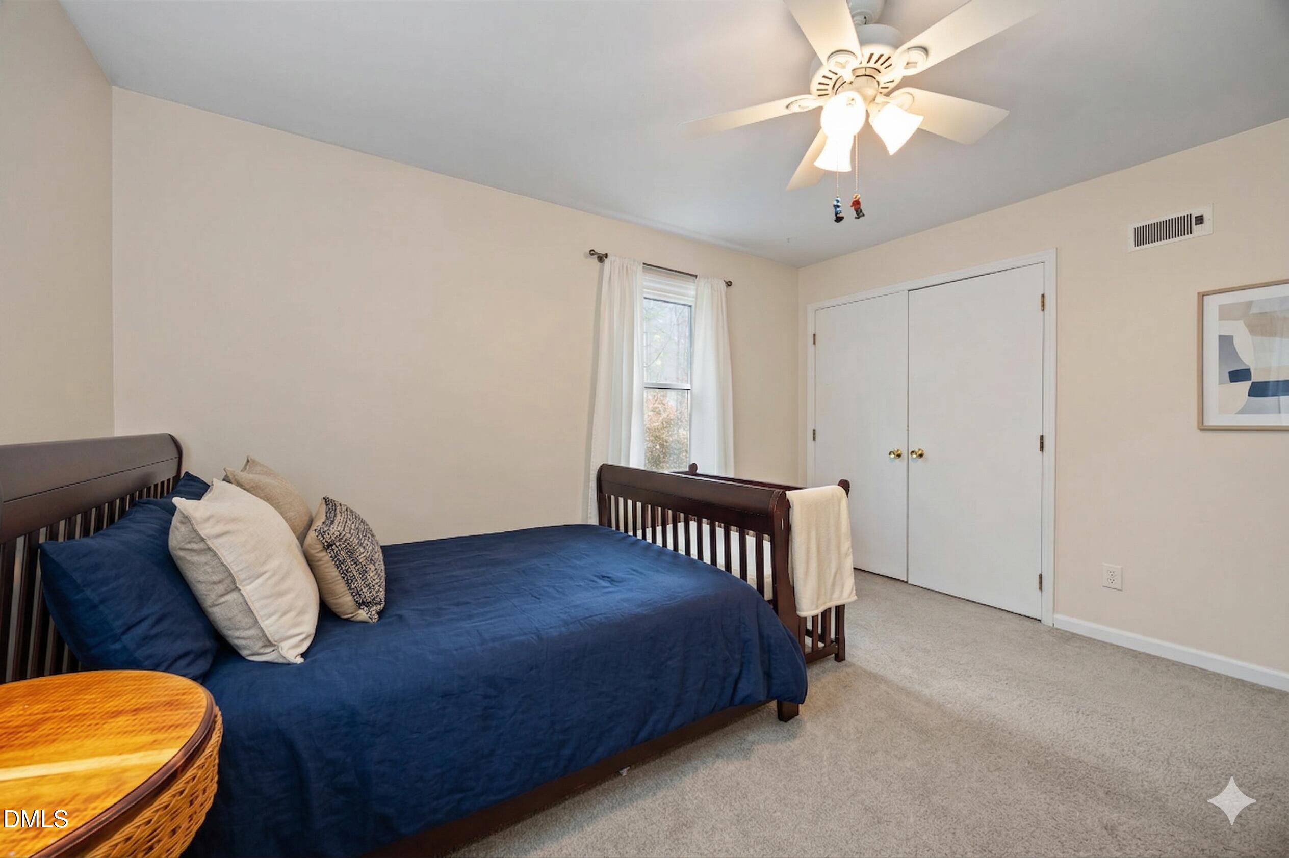 212 Esquire Lane Cary, NC 27513 - Photo 17 of 31 a bedroom with furniture and a window