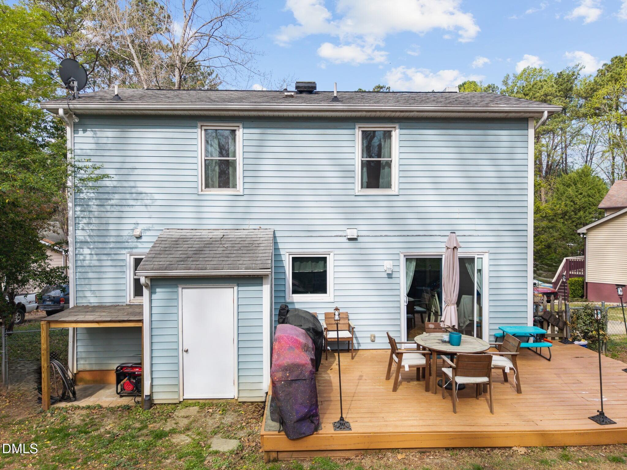 212 Esquire Lane Cary, NC 27513 - Photo 19 of 31 a view of a patio with table and chairs and potted plants