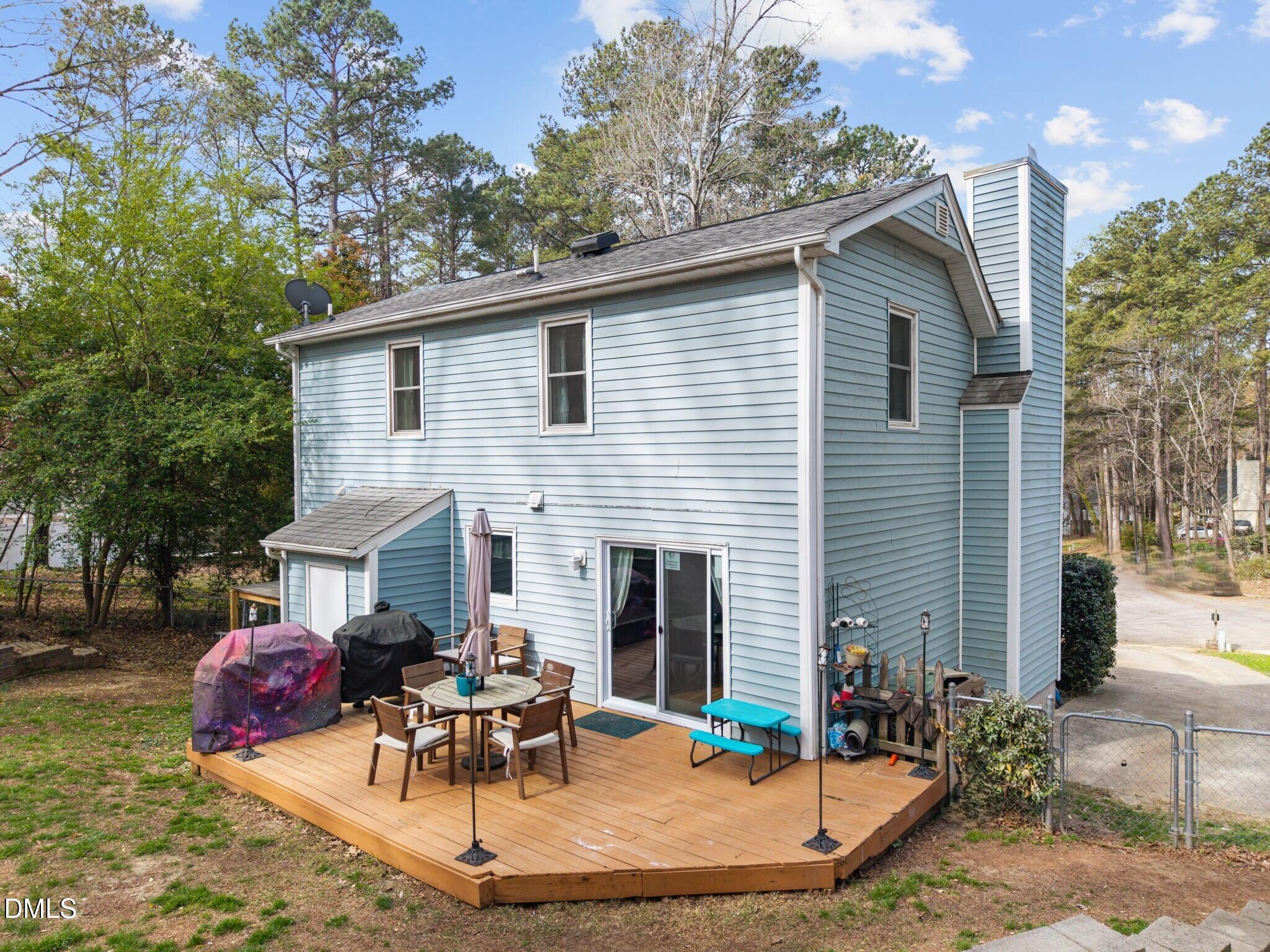 212 Esquire Lane Cary, NC 27513 - Photo 20 of 31 a view of a house with a patio